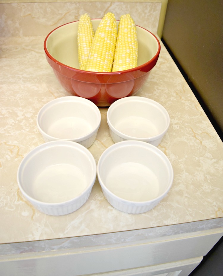 corn, mixing bowl and ramekins for making fresh corn spoonbread