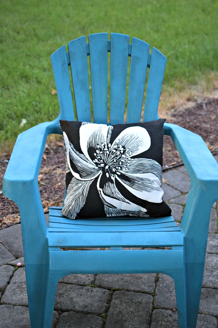 Adirondack chair with an outdoor pillow