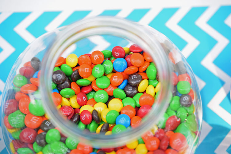 Candy-filled glass canister for teen birthday party