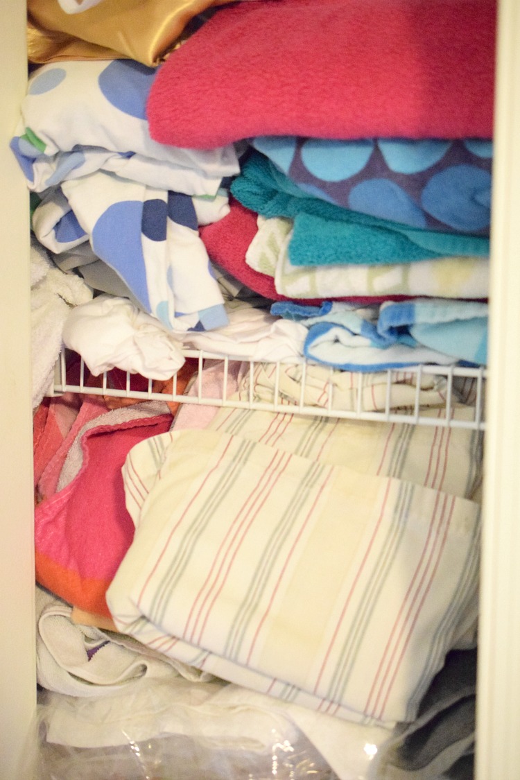 unorganized linen closet