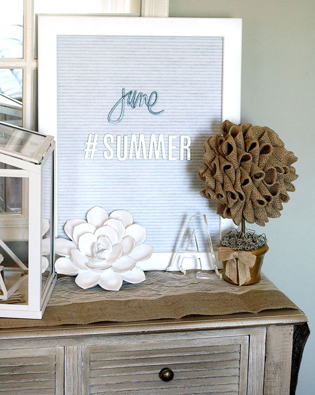 summer console table with letter board and DIY burlap topiaries