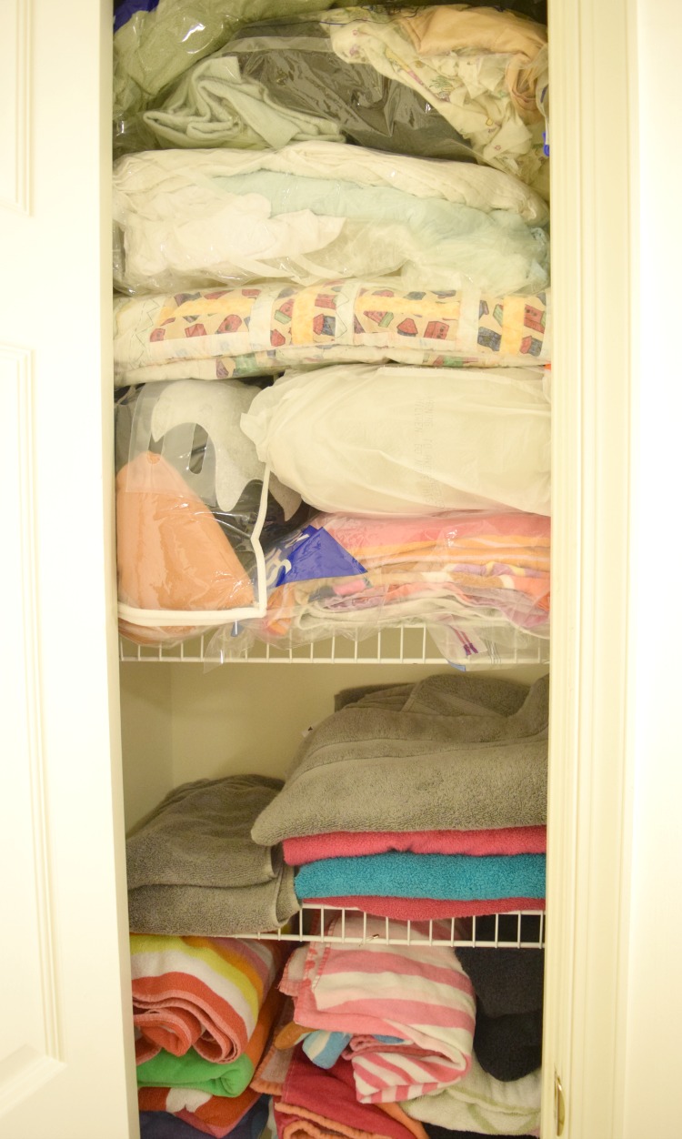 A linen closet organized in minutes with Ziploc storage bags
