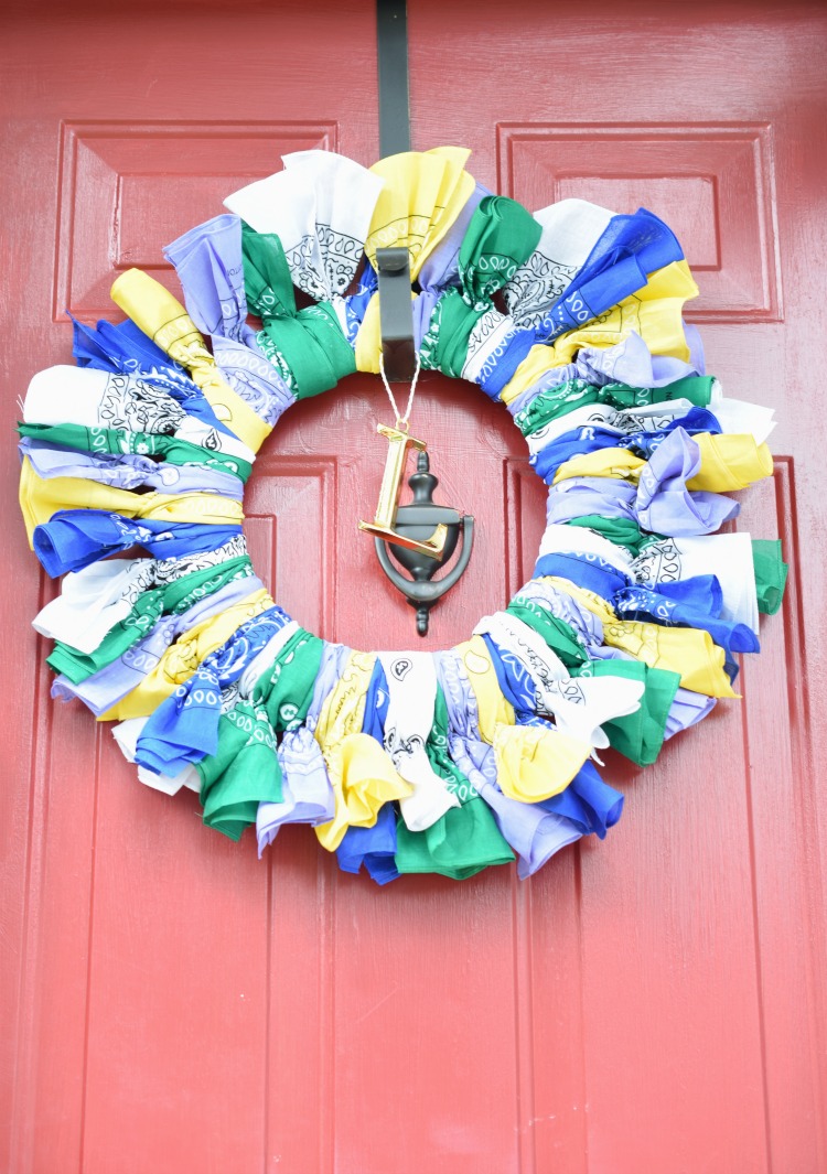 colorful bandana wreath on a red front door