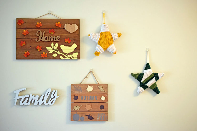 Fall gallery wall with DIY wooden signs and yarn wrapped stars