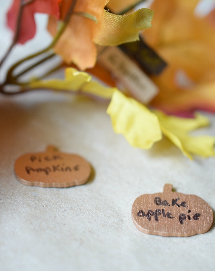 Decorative wooden pumpkin tokens for writing fall bucket list