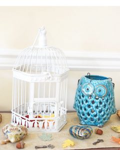 fall console table with white birdcage and blue lantern