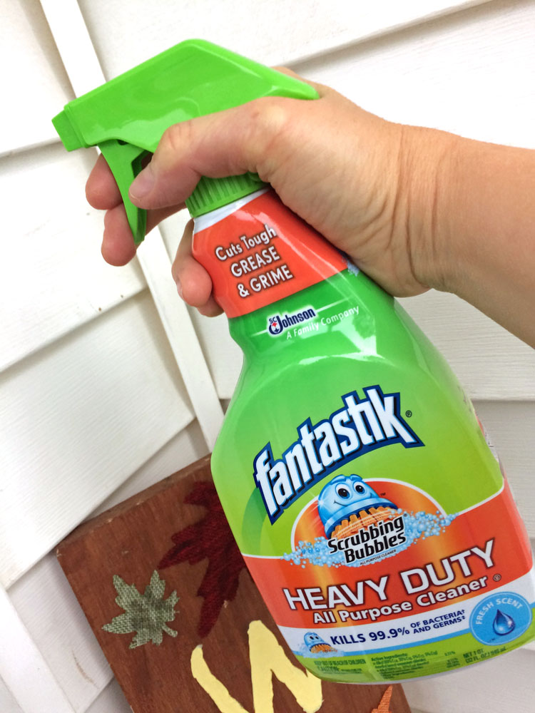 cleaning vinyl siding on a front porch with Fantastik Scrubbing Bubbles