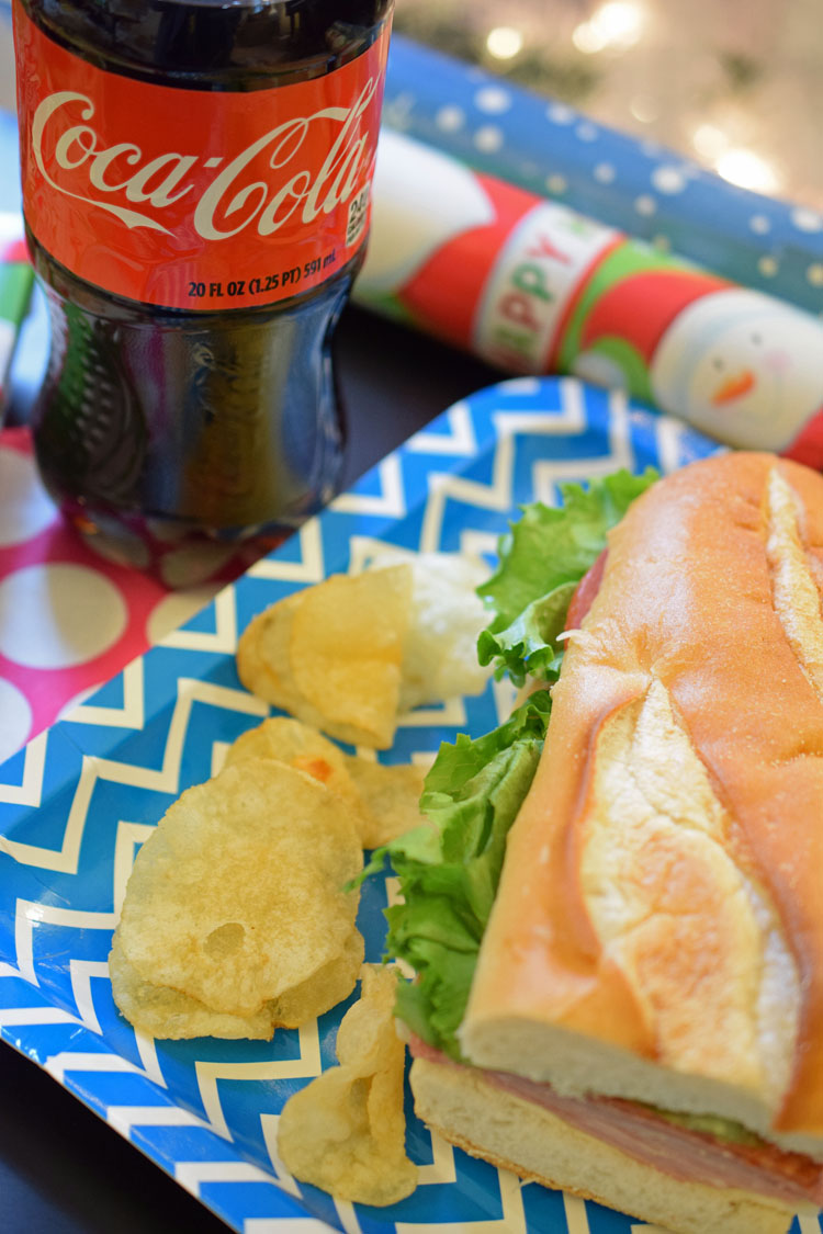 a gift wrapping party with a deli meal combo with a Coca-Cola from Stop & Shop