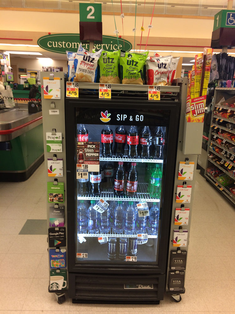 A fridge of cold Coca-Colas to go at Stop & Shop