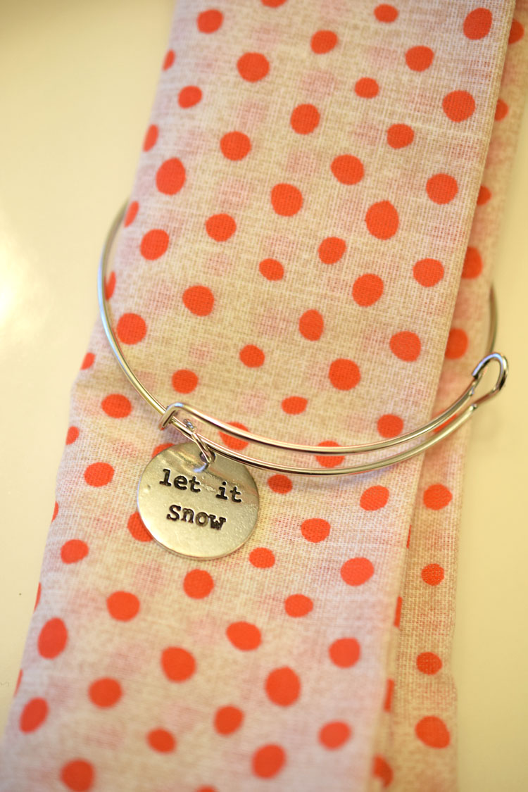 holiday napkins with DIY charm bracelet napkin rings