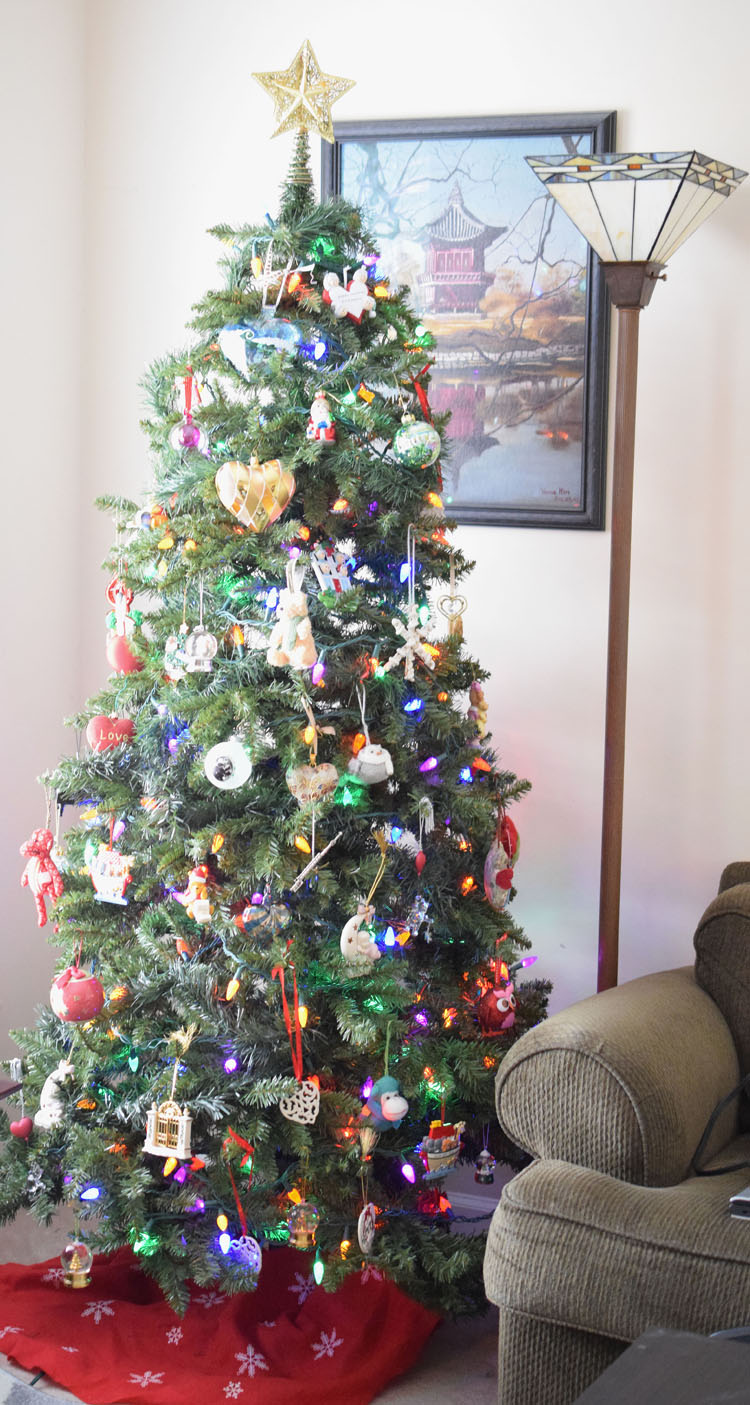 a family Christmas tree decorated with sentimental ornaments collected over the years