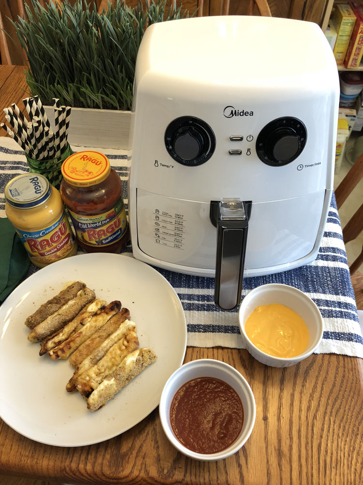 The Midea Air Fryer is great for making homemade breaded mozzarella sticks for the big football game day party