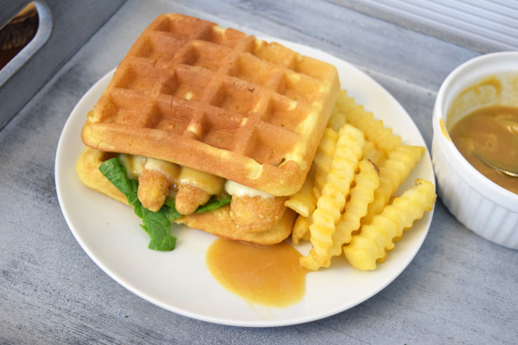 chicken and waffles sandwich with pepper jack cheese and a maple honey mustard sauce