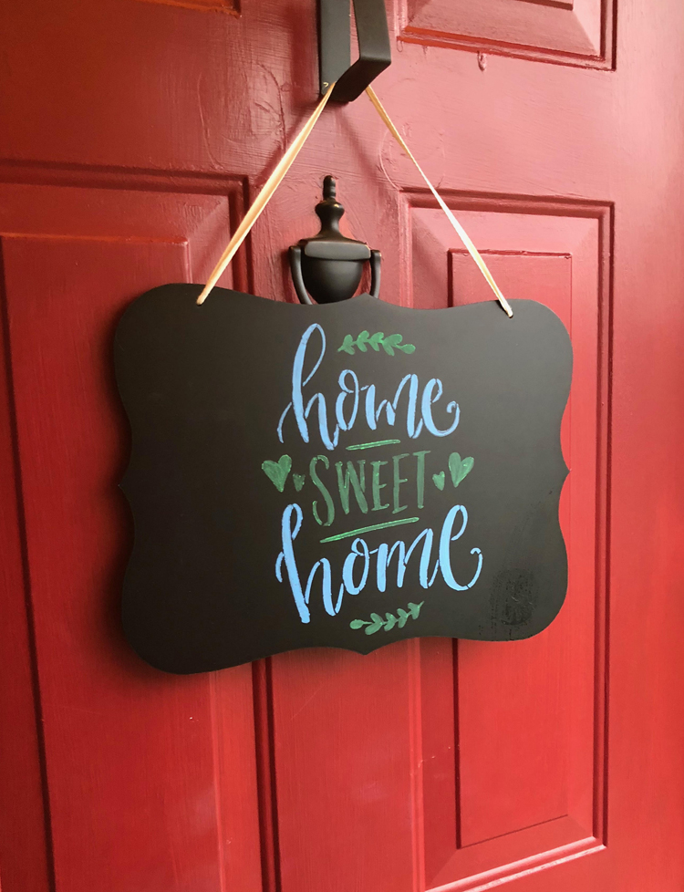 This home sweet home door decor can be made easily with an inexpensive hanging chalkboard, a stencil and some liquid chalk markers