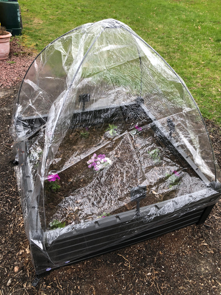 Keter raised garden kit with a protective cover