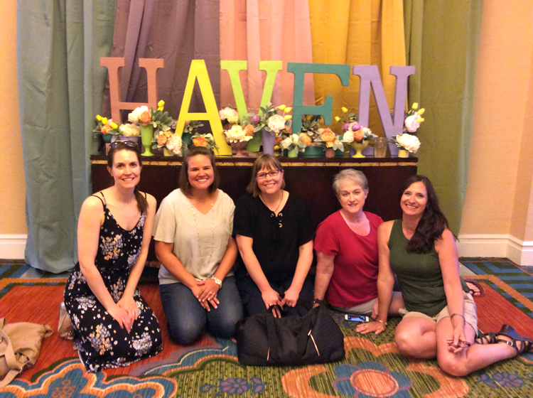 Bloggers seated in front of colorful Haven letters at the 2018 blog conference in Charleston, S.C.