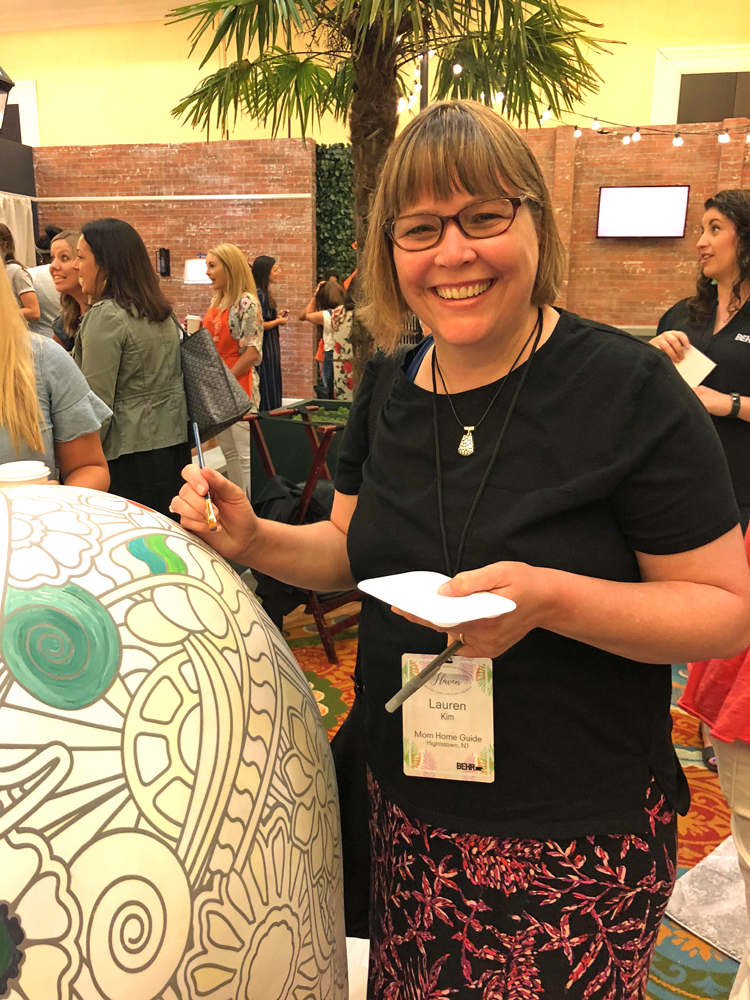 lauren kim of mom home guide painting the behr bear at the 2018 Haven blog conference in Charleston, S.C.