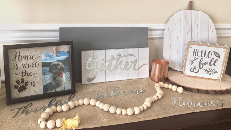 fall console table with metal welcome sign, wood beads, gather sign and wooden pumpkin