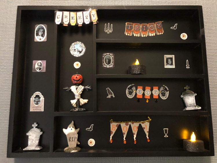 I love this easy DIY Halloween display case for displaying cute holiday miniatures.