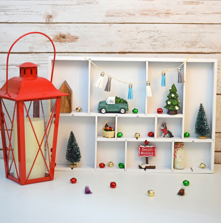 A cute DIY Christmas shadow and curio box made from a simple drawer organizer.