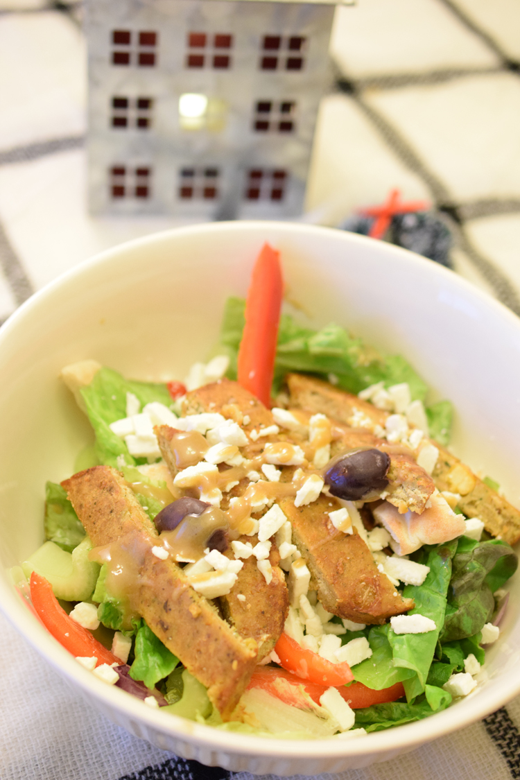 Serve your family and delicious vegetarian meal by making this delicious green salad with Morningstar Falafel Burgers and homemade tahini dressing