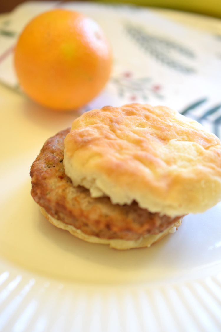 Breakfast sandwich with an orange on a pretty holiday table