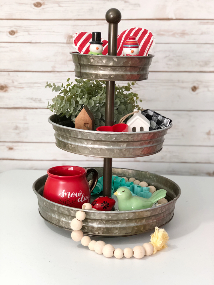 A galvanized tin tiered tray decorated for Valentine's Day