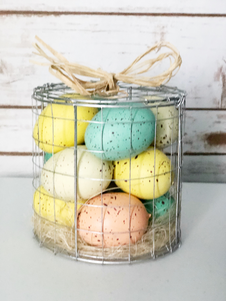 Pastel speckled Easter eggs in a wire basket