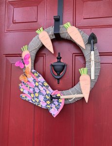 This spring gardening wreath is easy to make and can be made with supplies from the dollar store