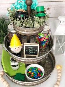 This tiered tray decorated for St. Patrick's Day is sure to please with candy and fun miniatures