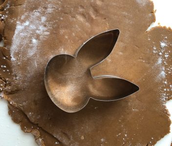 Making gingerbread Easter cookies with an Ann Clark bunny cookie cutter.