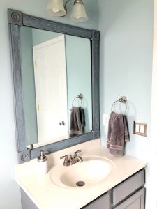 How to make an easy DIY frame for a builder grade bathroom mirror