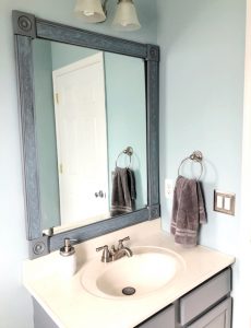 How to make an easy DIY frame for a builder grade bathroom mirror