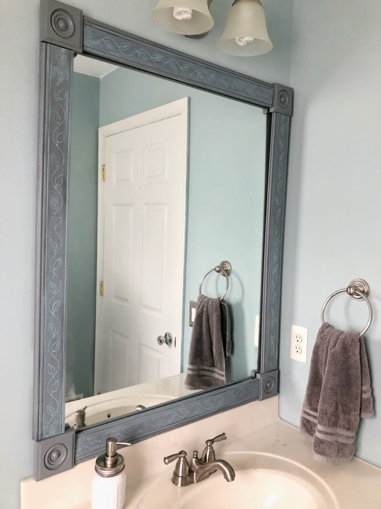 How to Make an Easy DIY Bathroom Mirror Frame - momhomeguide.com