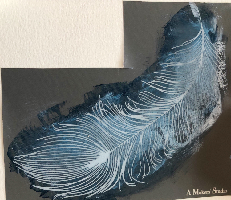 blue and white paint on a feather stencil