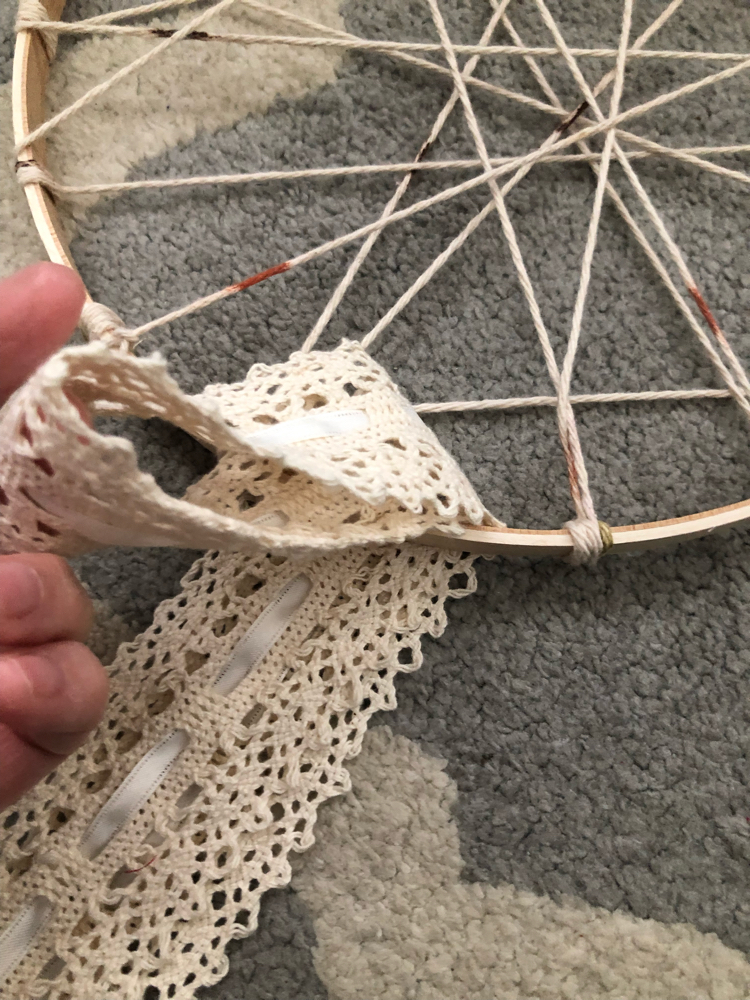 tying lace onto a DIY dream catcher