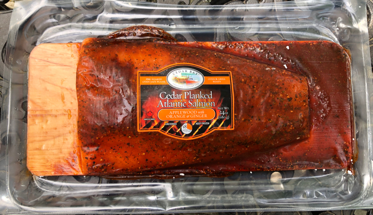 The Atlantic Salmon portions from Cedar Bay Grilling Company come pre-seasoned (this is orange ginger) and come on their own pre-soaked cedar planks.