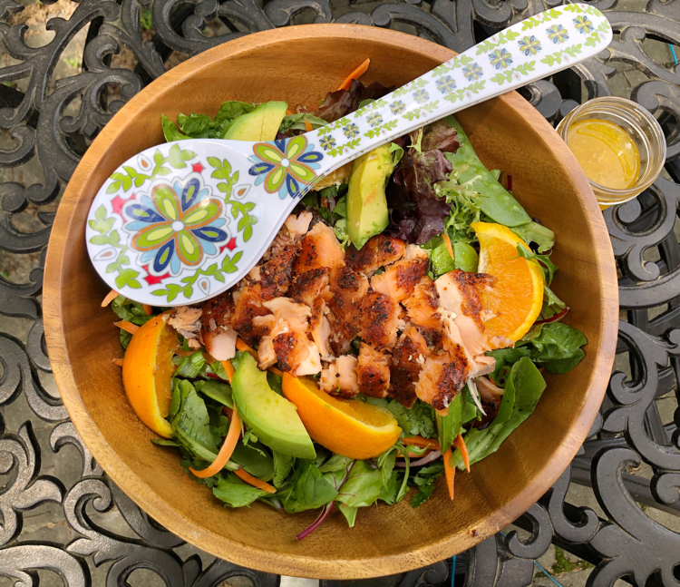 I love this orange and ginger green salad with smoky salmon cooked on a cedar plank