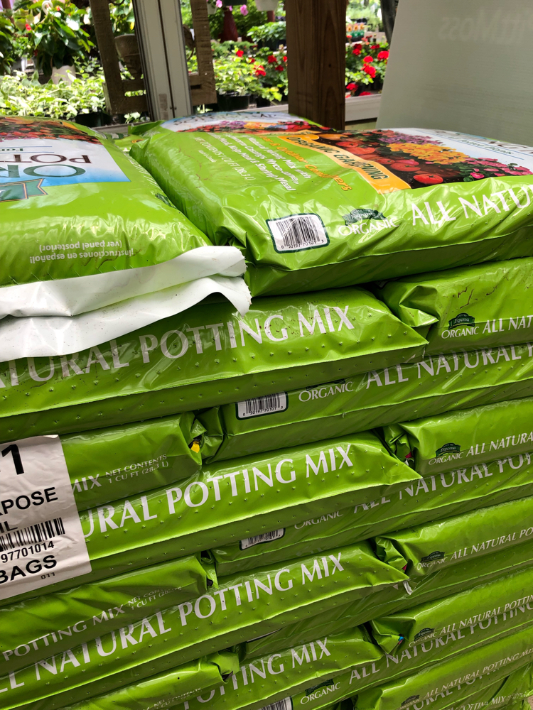Bags of potting mix at a garden store