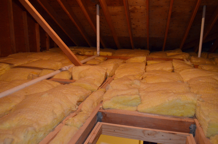 My home's attic before my husband put in easy to install Attic Dek flooring