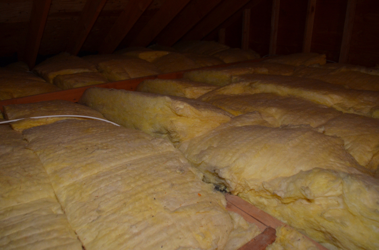 Our attic before my husband put in easy to install Attic Dek flooring