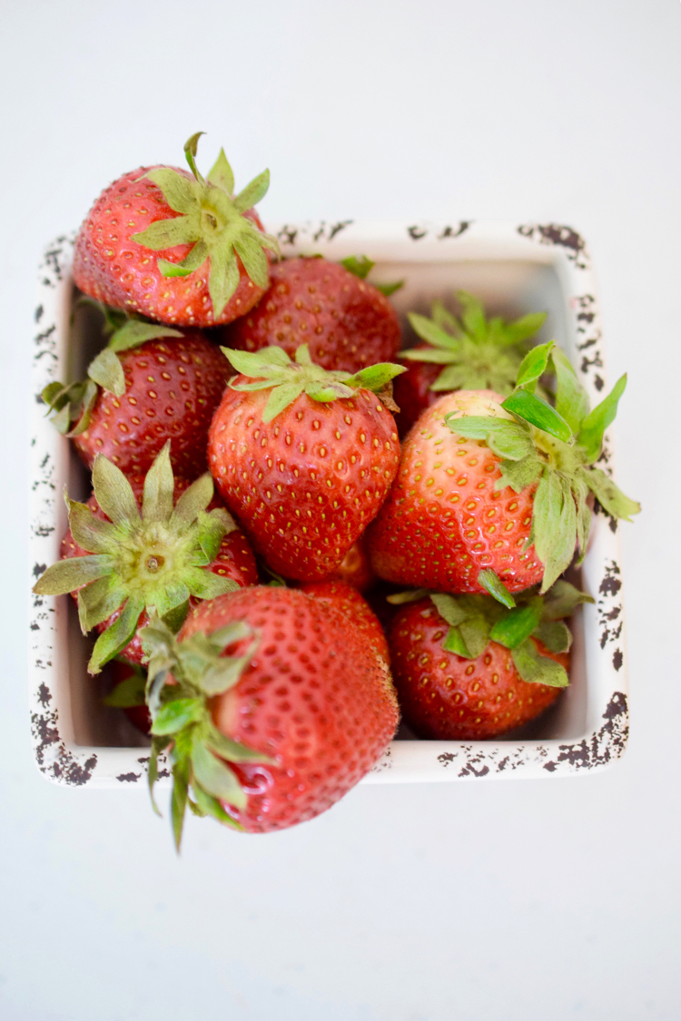 Fresh summer strawberries in a ceramic basket