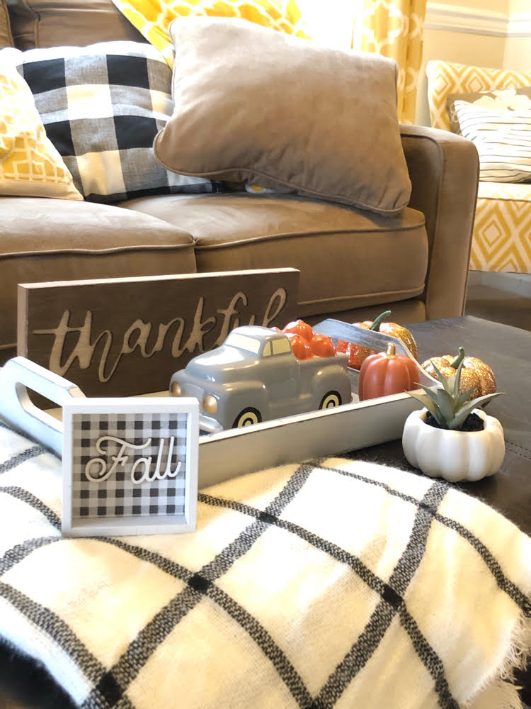 A coffee table decorated for Thanksgiving with items from Target and Oriental Trading