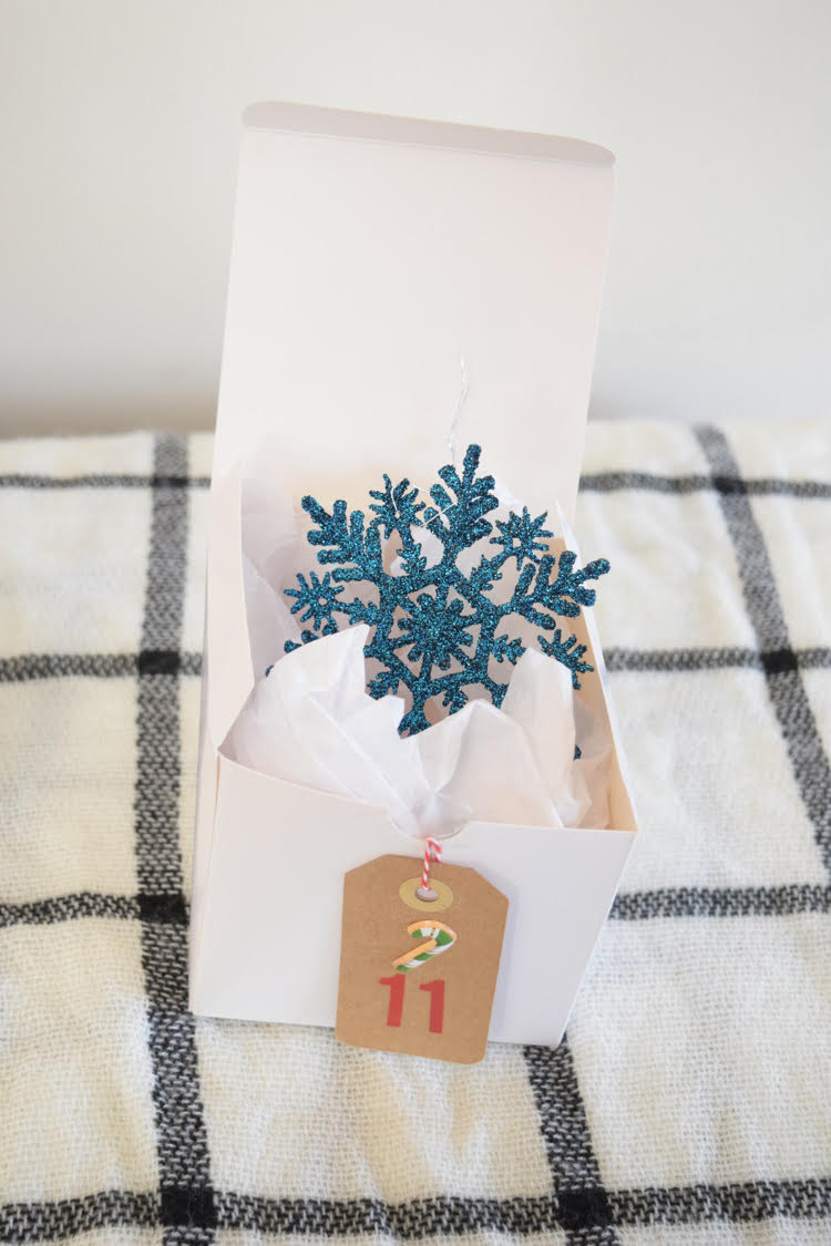 How to create a cute DIY Advent calendar out of gift boxes. Plus, advent calendar filler ideas.