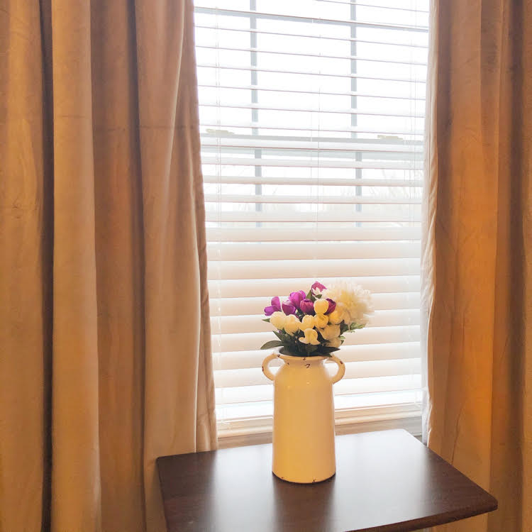 The velvet Therapedic® Carlisle 100% Blackout Rod Pocket Window Curtain Panels are beautiful and blissfully darken a bedroom for sleep. (Available at Bed, Bath & Beyond)