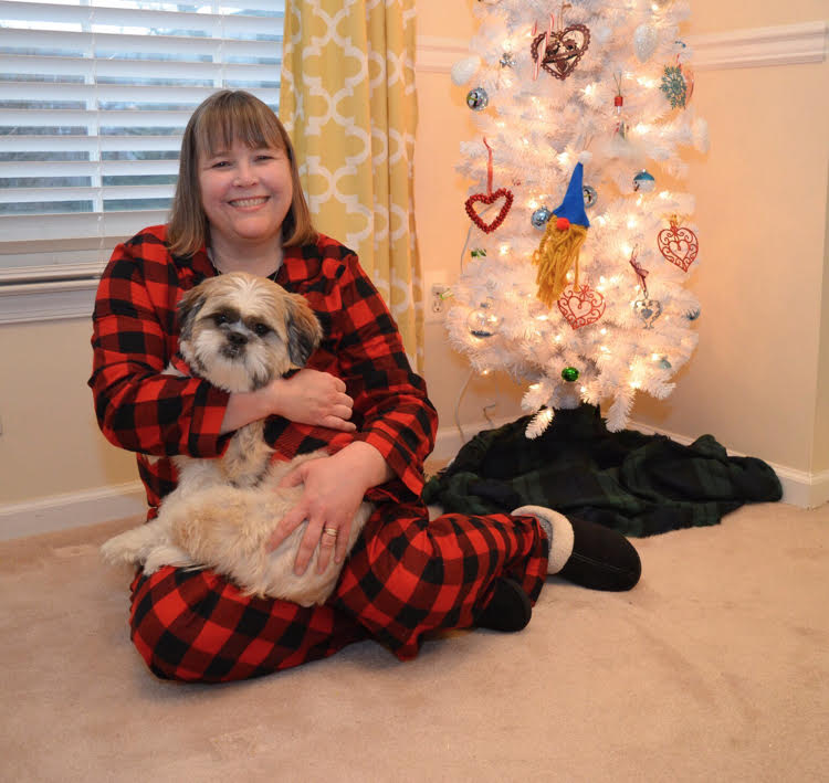 Blogger Lauren Kim with her Shih Tzu puppy and her gnome decorated Christmas tree