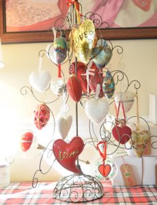 My husband gives me heart ornaments every year. Most of them are on this ornament tree. Sometimes I keep it up all year! Plus, stop by the blog t o see several of my blogging friends' Christmas trees!