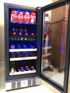 Side view of the sleek dual=temperature zone wine/beverage fridge by NewAir. This fridge offers plenty of wine and beverage storage in a small space.