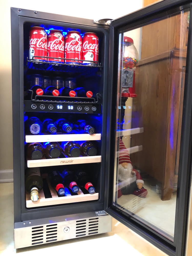 Side view of the sleek dual=temperature zone wine/beverage fridge by NewAir. This fridge offers plenty of wine and beverage storage in a small space.