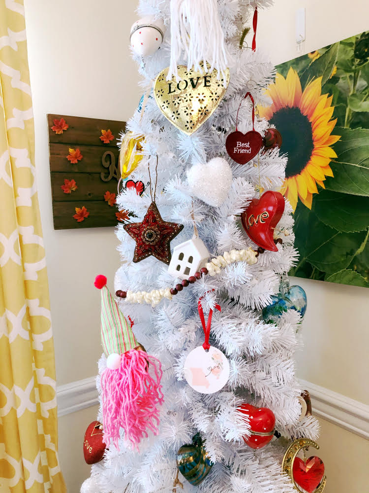 A white Christmas tree decorated for Valentine's Day